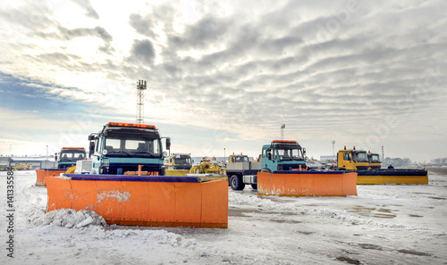 Obraz na płótnie Snow removal vehicles in the airport