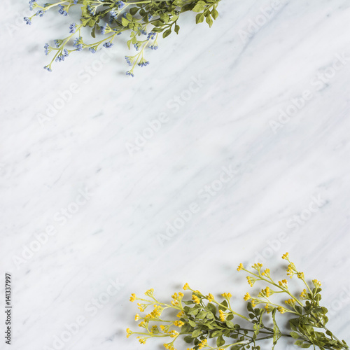 Decorative wild flower branches on Carrara marble worktop