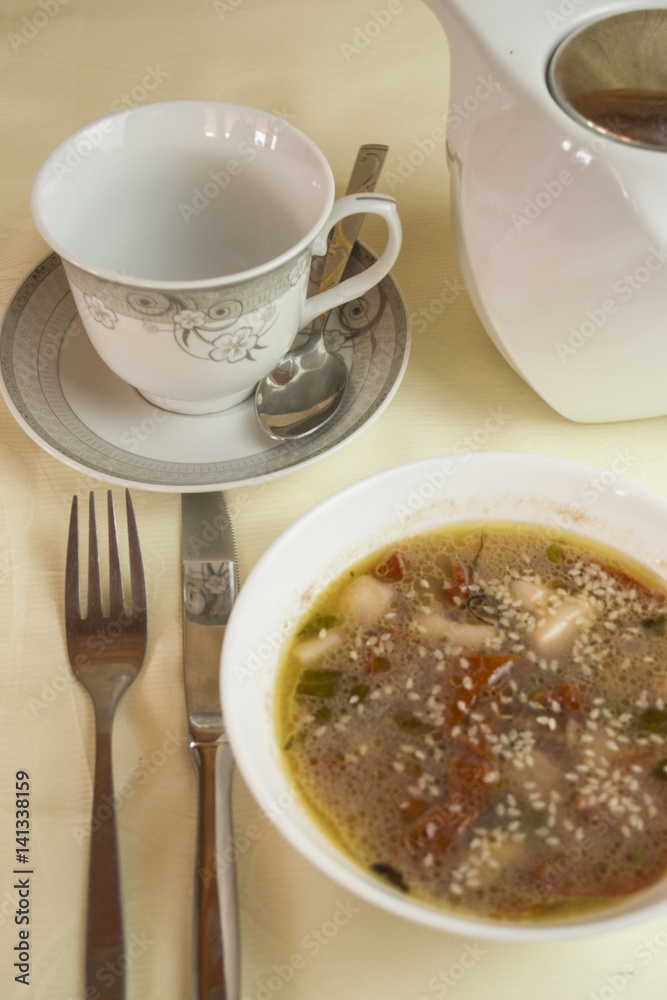 Gravy Soup in a White Ceramic Bowl Isolated