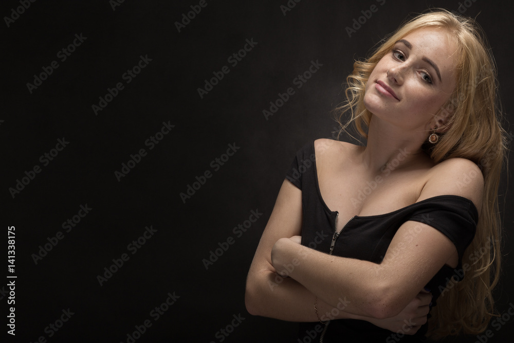 sensual young woman with freckles on black background with copyspace sensual young woman with freckles on black background with copyspace