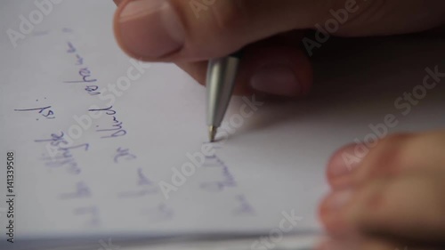 lovesick young man writing love letter with broken heart photo