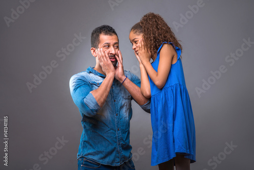 Young black father with his teenage daughter