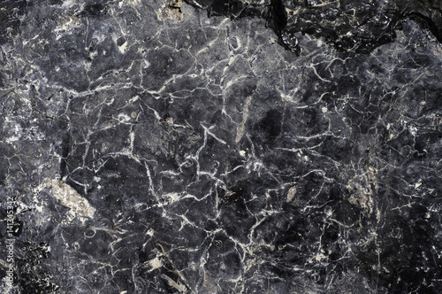 Abstract black stone  background with cracks