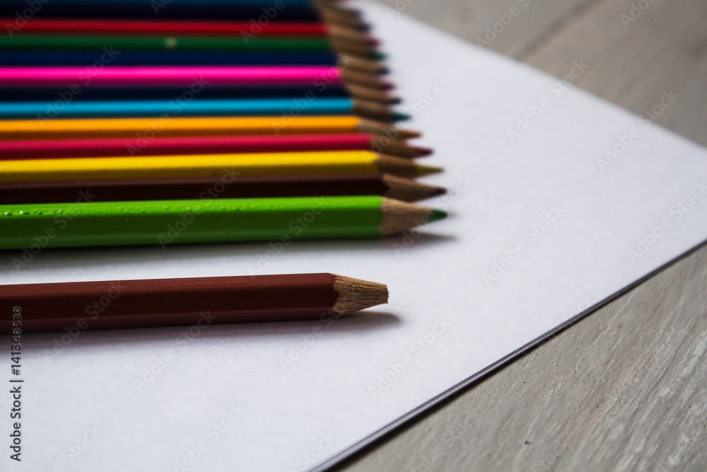 a row of colored pencils folded a row of colored pencils folded