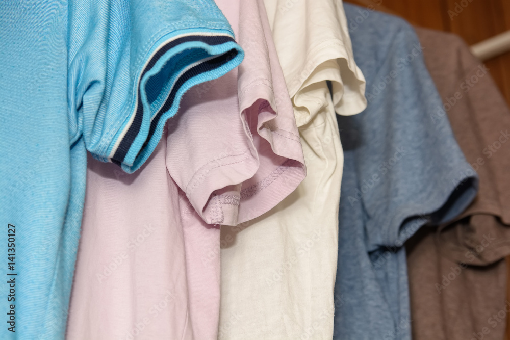 Colorful t-shirts on hangers Colorful t-shirts on hangers