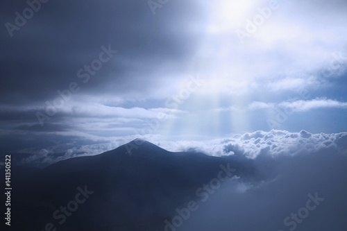Picturesque view of the mountains that glow under sunlight. Dramatic evening scene. Location place Carpathian Mountains, the highest mountain of Ukraine - Hoverla. Artistic picture. Beauty world.