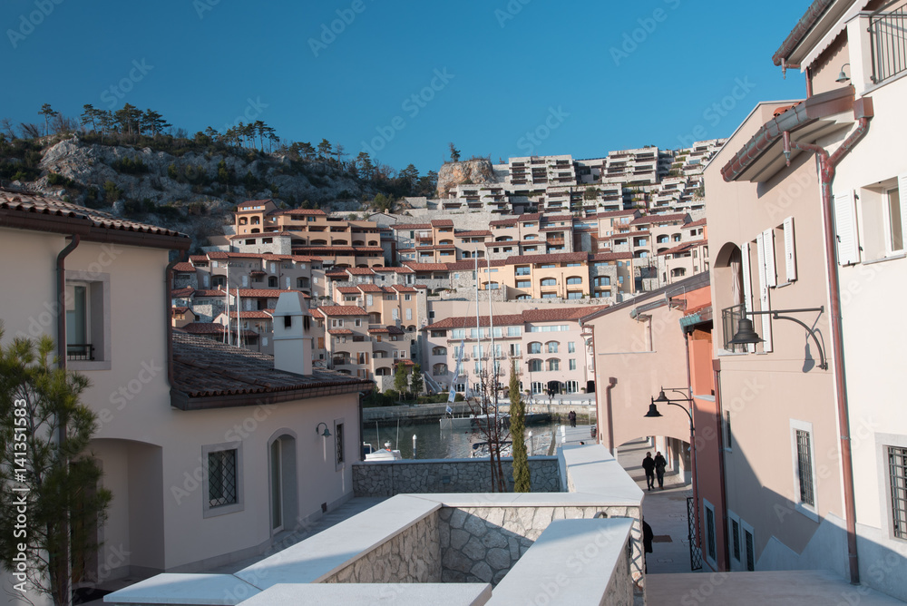 Obraz premium Sunset, golden light on the seaside village. Love Walk