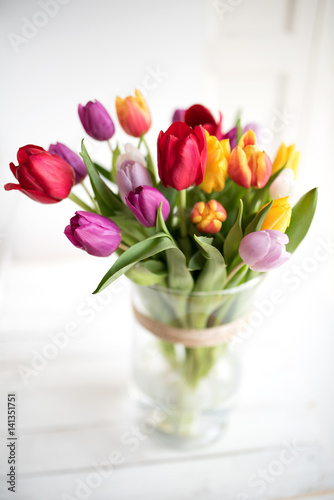 Colorful tulips in a glass vase