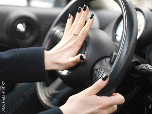 Female Hand On Car Horn