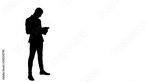 Silhouette Young businessman using digital tablet