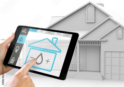 Hand holding digital tablet with home security icons on screen
