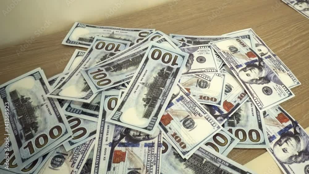 Falling hundred dollars banknotes close up Falling hundred dollars banknotes close up