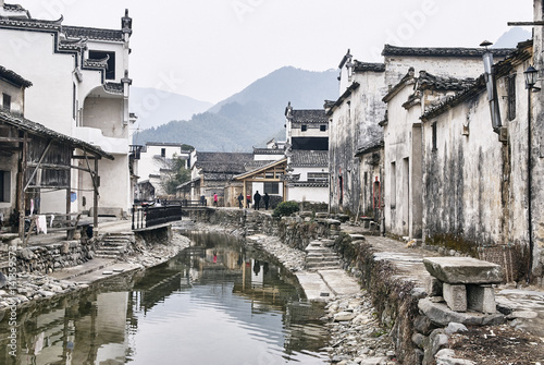 Traditional houses by waterway, Hongcun Village, Anhui Province, China photo