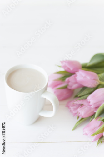 Mug and Pink tulips on white background