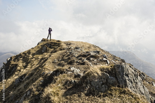 Woman on top of Marsco, Glen Sligachan, Isle of Skye, Scotland photo