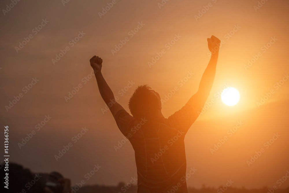 Man show hands silhouette sunset background 