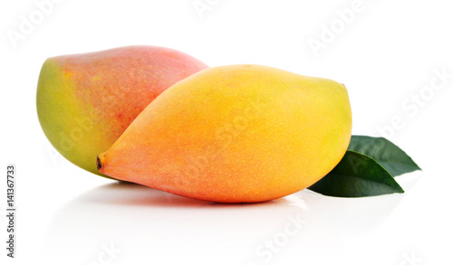 Ripe mango fruit with leaves