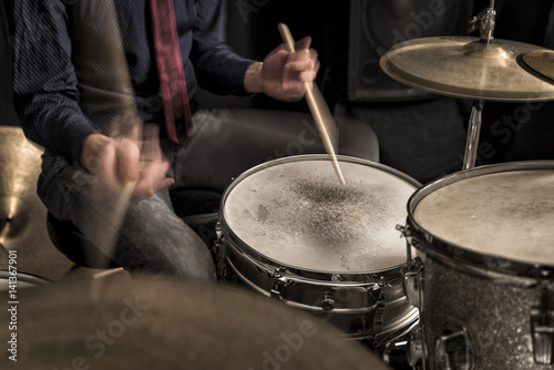 Drummer playing a rhythm, swing, motion blur