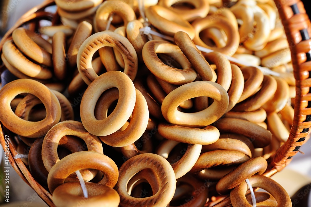 Fototapeta premium Round bagels close-up in wicker basket