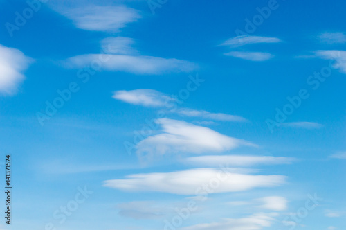 white fluffy clouds in the blue sky background texture.