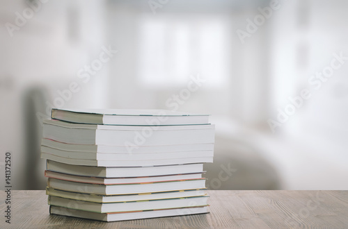 books on wooden table © vlntn