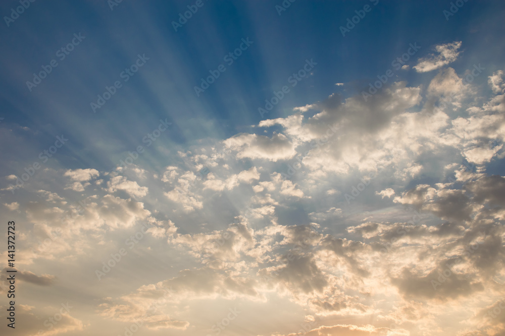 Sun beam in golden Clouds. Soft background of blue sky before a sunrise