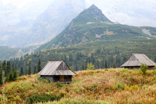 Two wooden cottage among the mountains