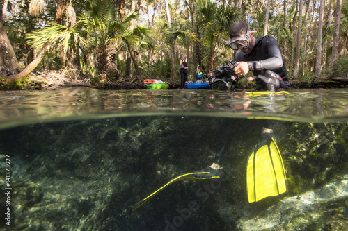 Man preparing underwater camera photo