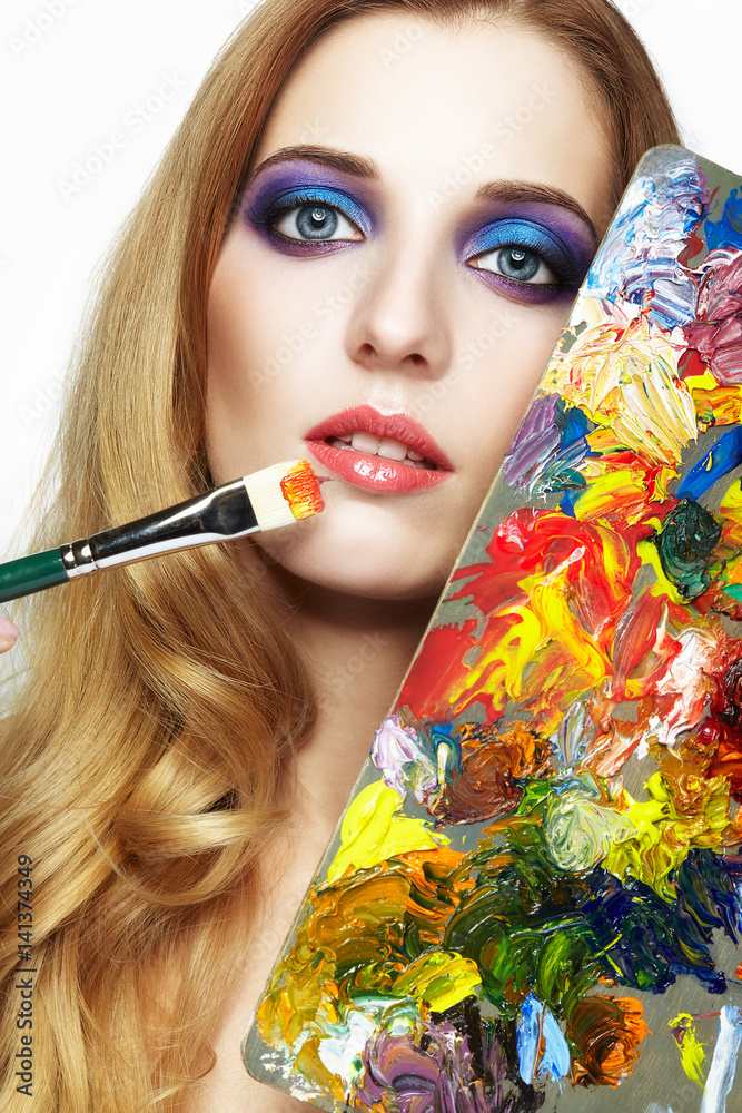 Young woman painter with color palette and paint brush Stock Photo ...
