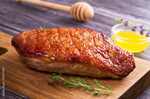 Duck breast, lavender honey and thyme, served on chopping board
