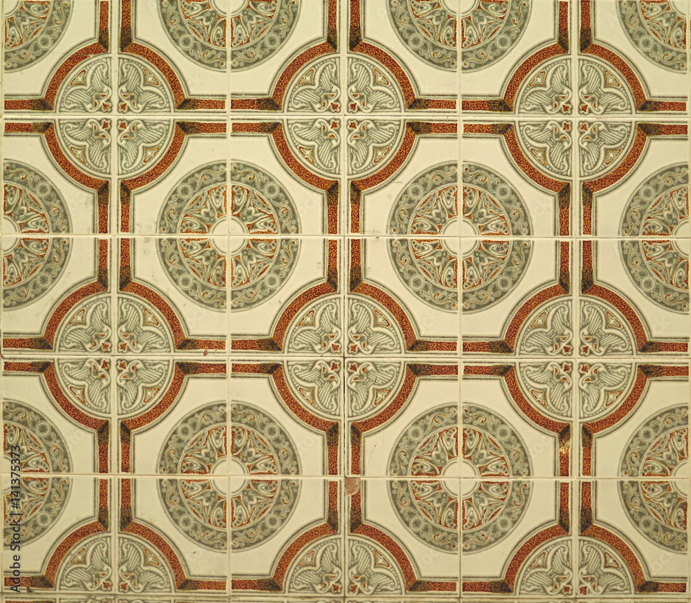 Wall tiled with green brown circular floral ceramic tiles