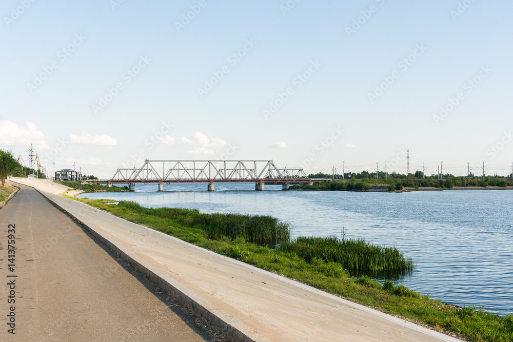 Embankment and railway bridge through the river Volga in Syzran,