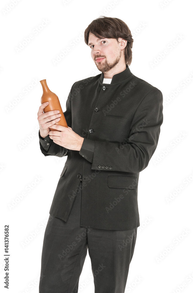 Young priest with bottle of alcohol isolated Young priest with bottle of alcohol isolated