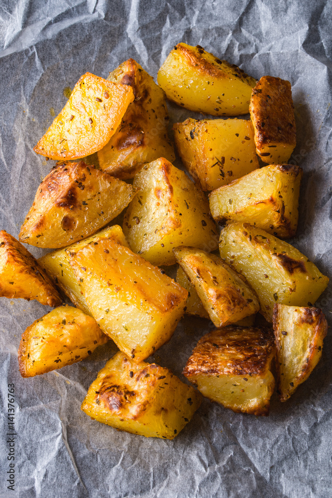 Grilled potatoes on backing paper Grilled potatoes on backing paper