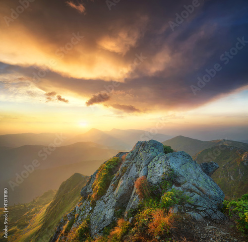Mountain valley during bright sunset. Beautiful natural landscape in the summer time