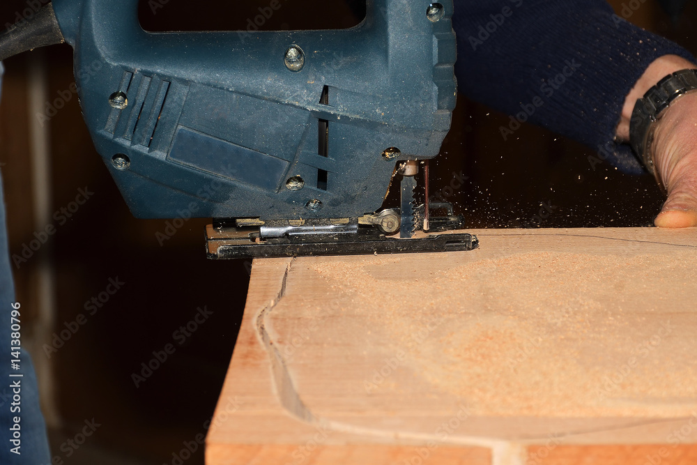carpenter working with plane on wooden background carpenter working with plane on wooden background