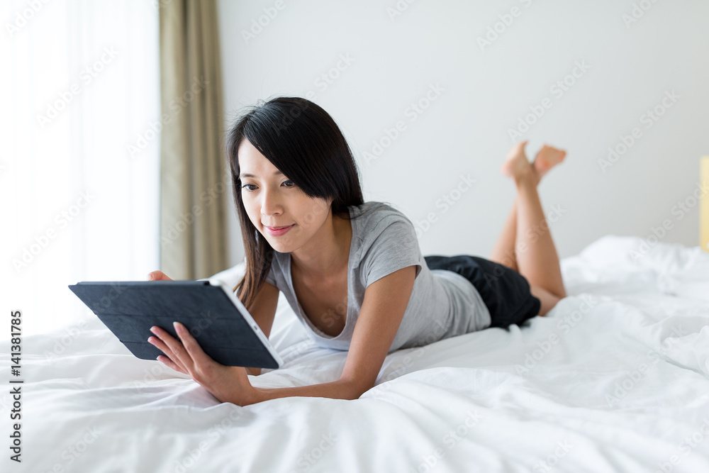 Woman enjoy using tablet computer at home Woman enjoy using tablet computer at home