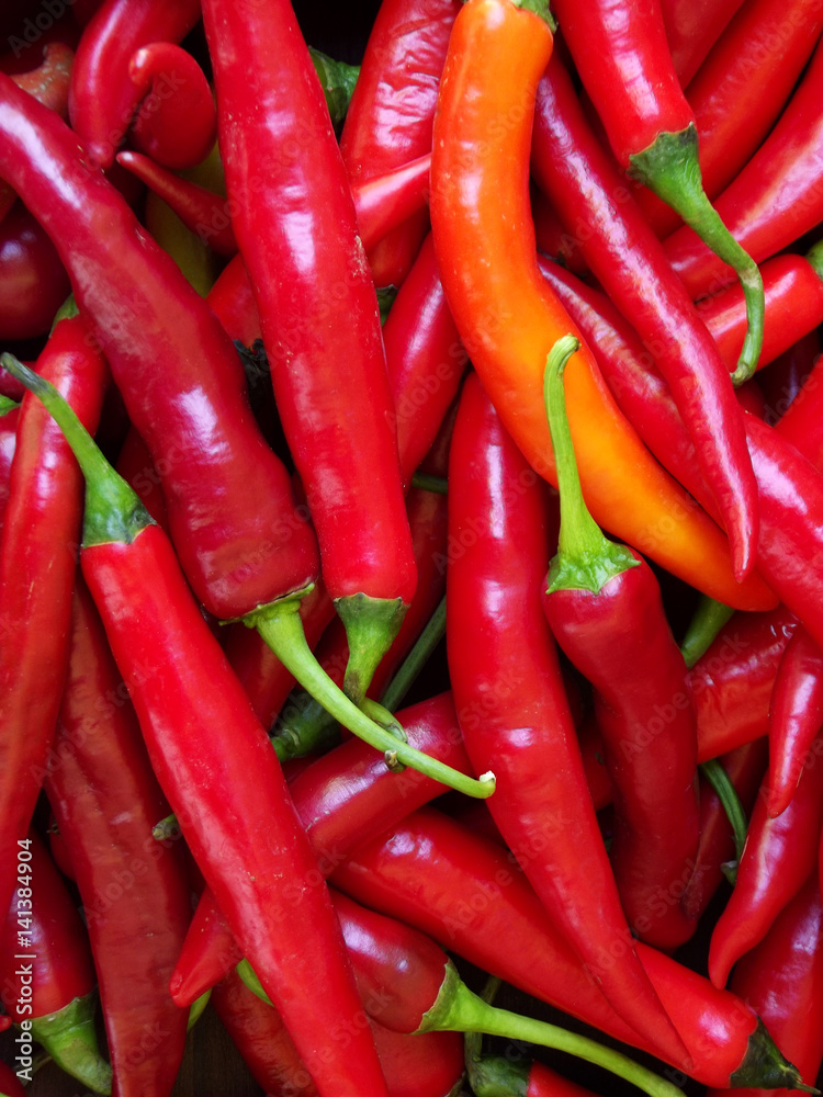 Food background of long red hot pepper