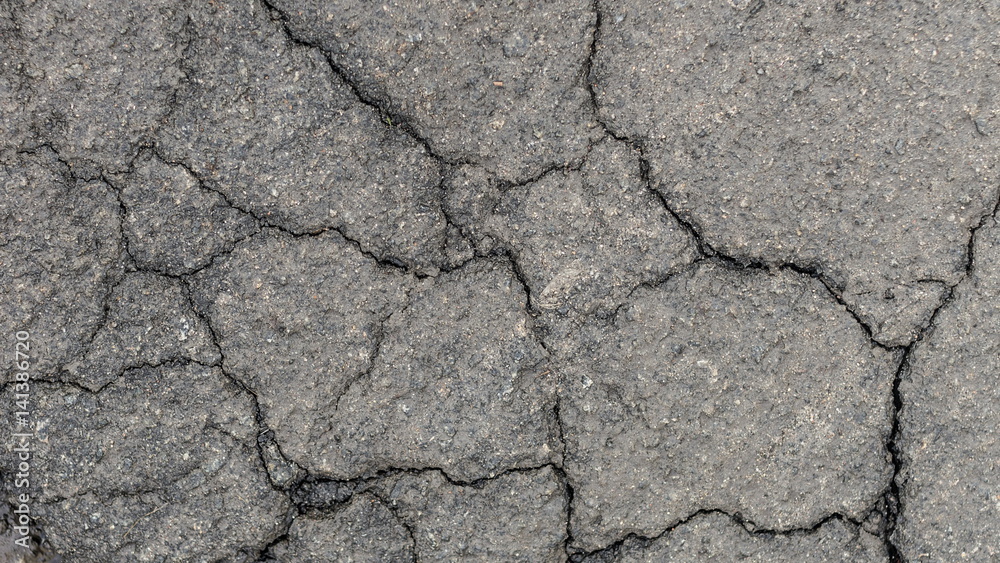 Wet cracked asphalt Wet cracked asphalt