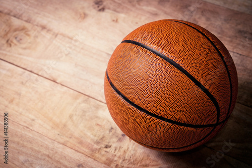 A basketball on a wood