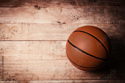 A basketball on a wood