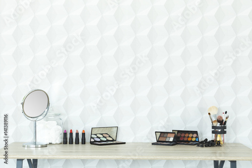 Makeup accessories on a desk photo