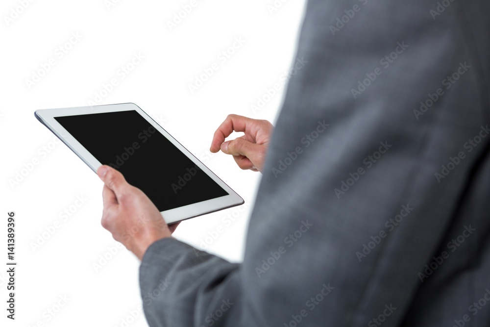 Mid section of businessman using digital tablet Mid section of businessman using digital tablet