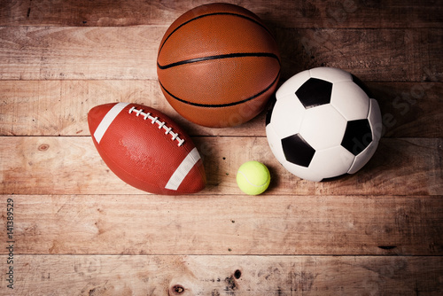 Sports balls on wooden background