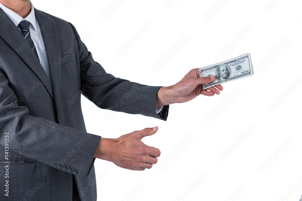 Mid section of businessman holding one hundred dollar Mid section of businessman holding one hundred dollar