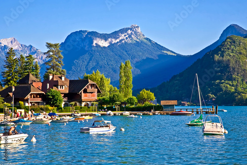 Restful town of Talloires, France, on the lake Annecy. Water sports, calm and peaceful bays and coves, swimming and relaxing. photo