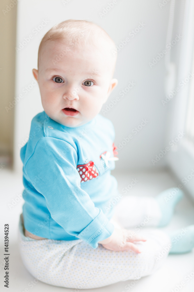 Surprised babe sitting on the windowsill Surprised babe sitting on the windowsill