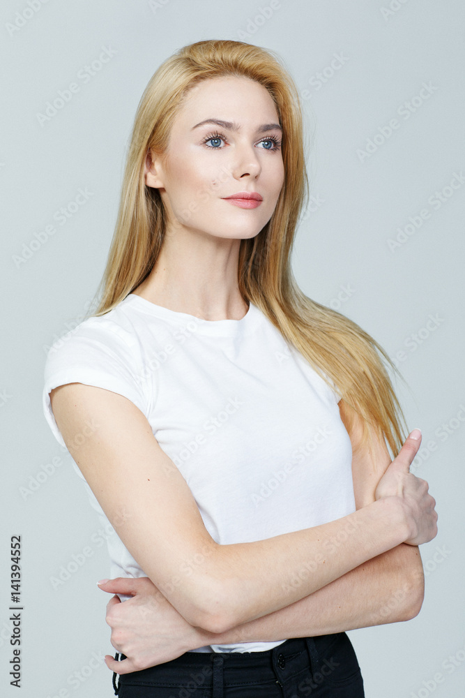 Portrait of a sexy blonde woman in studio on a grey background Portrait of a sexy blonde woman in studio on a grey background