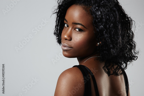 closeup portrait of black woman watching back at camera