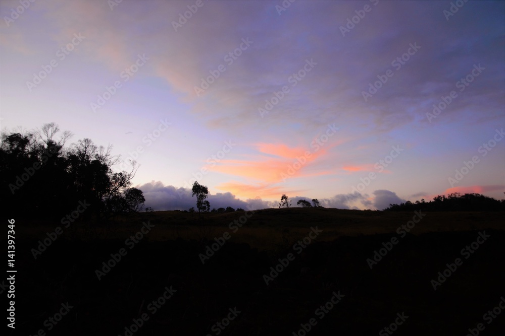 Long shot of a sunset over the ocean in Easter Island, Rapa Nui, Chile, South America